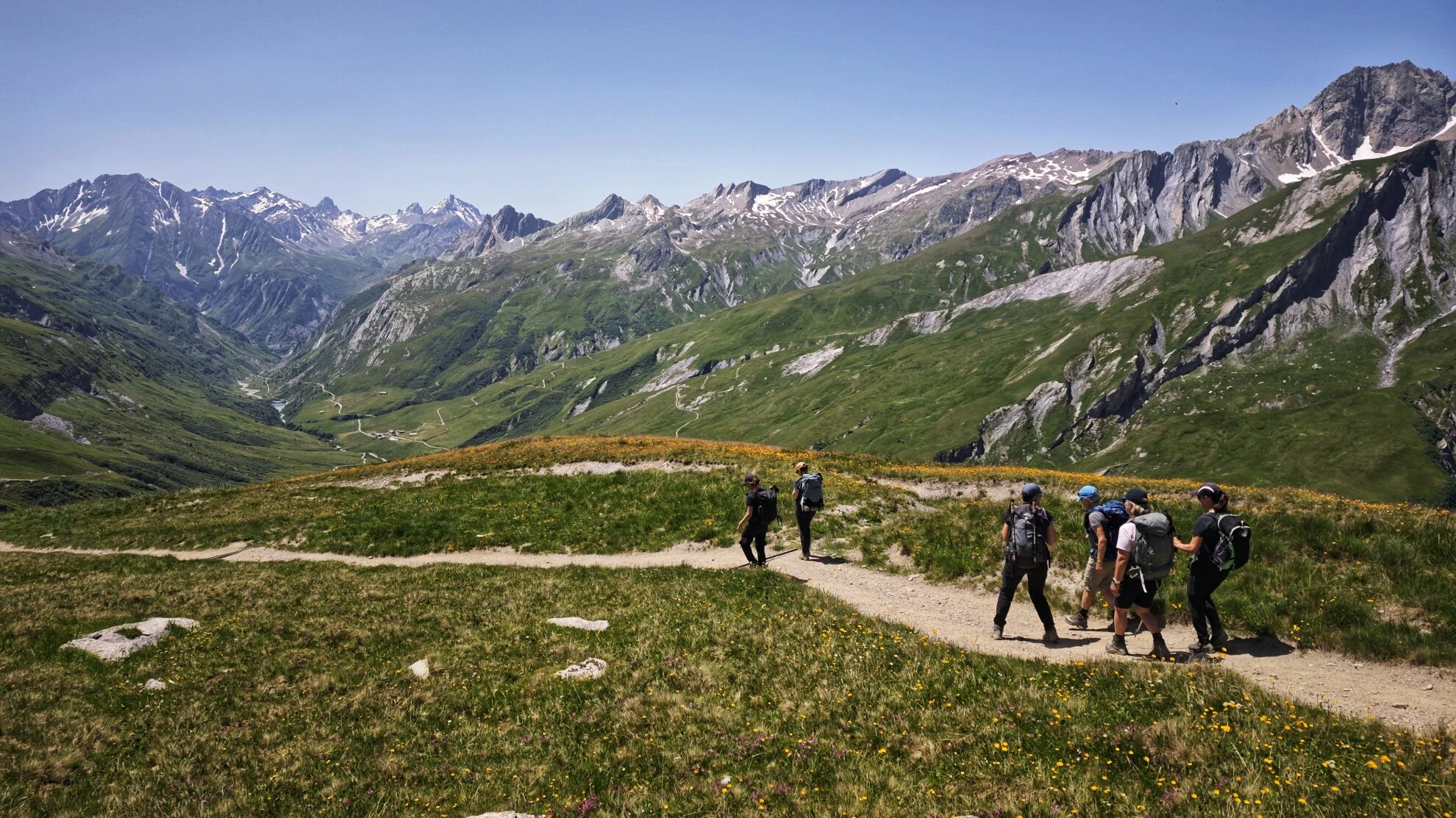 Hikers on the balcony trail above Val Veni
