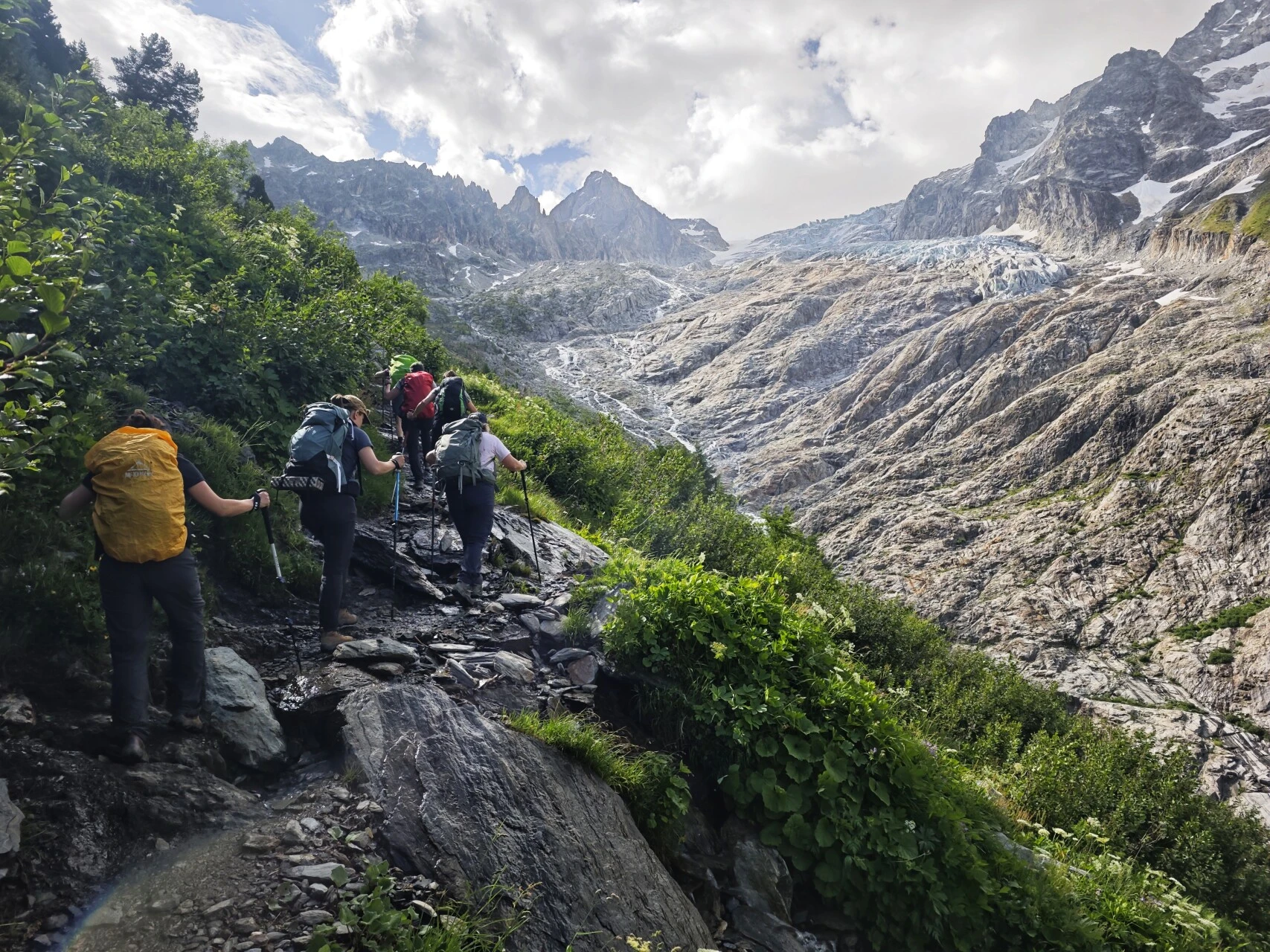 Hikers on the moraine of the Glacier du Trient