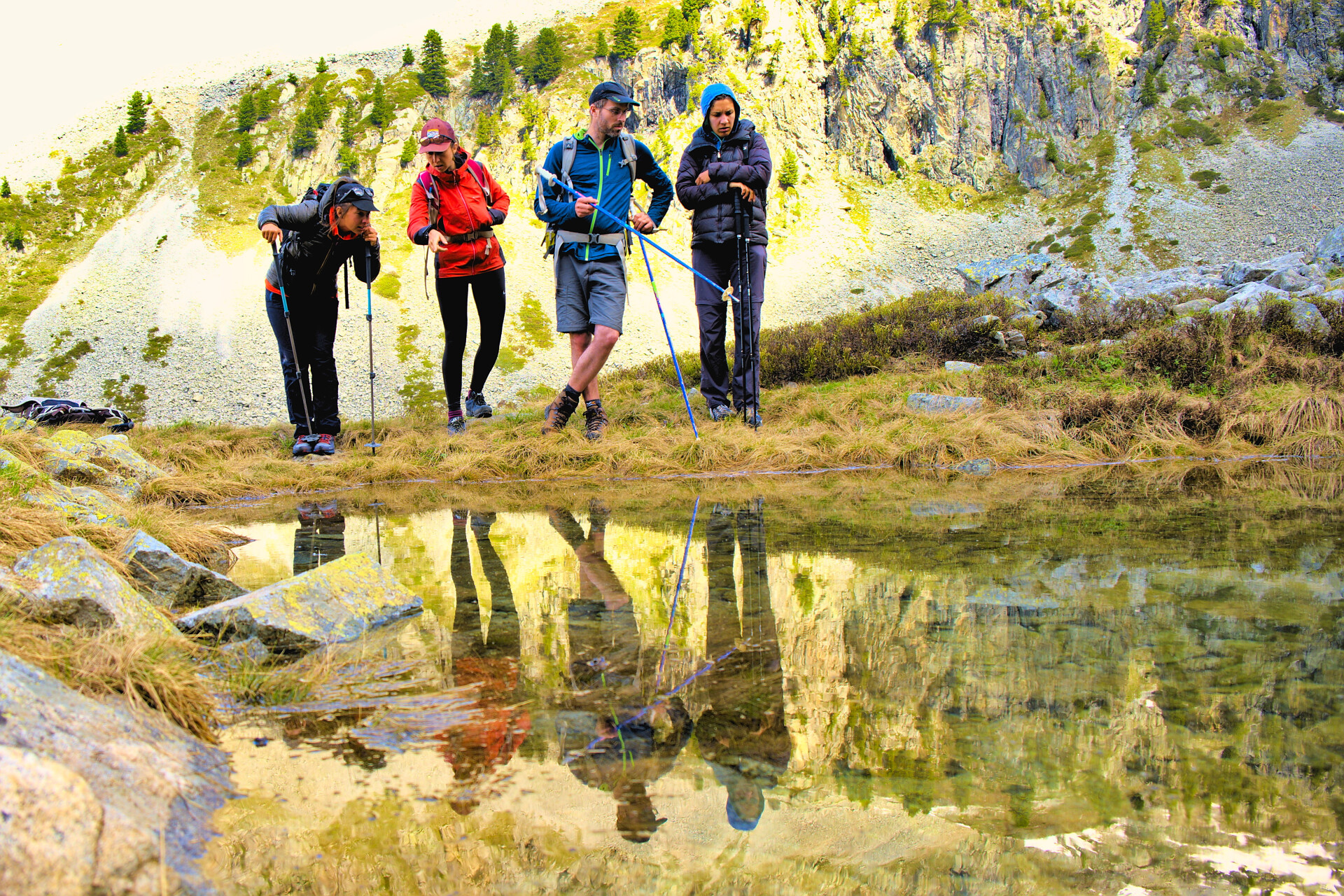 Walkers stopped by a mountain lake